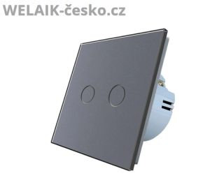 Skleněný dotykový vypínač Elegantní tmavě šedý dotykový vypínač kombinuje luxusní skleněný povrch a chytré řešení pro...